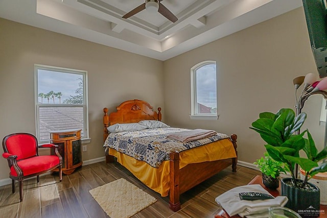 bedroom featuring coffered ceiling, ceiling fan, dark wood-type flooring, and multiple windows