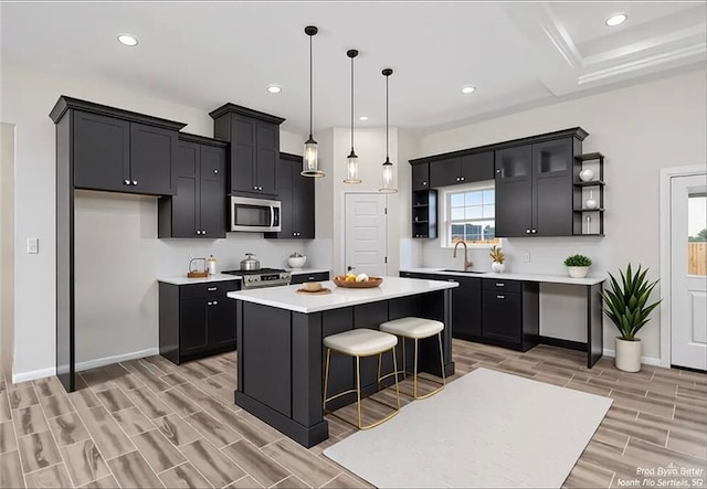 306 Frankie Ave, Donna, TX 78537 - kitchen featuring stainless steel appliances, open shelves, wood tiled floors, baseboards, and recessed lighting