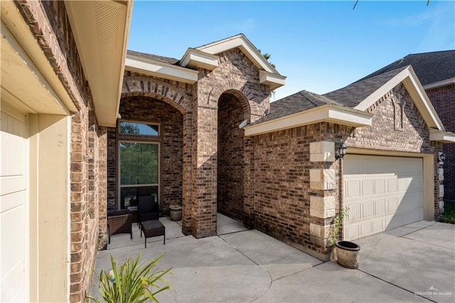 view of patio / terrace featuring a garage