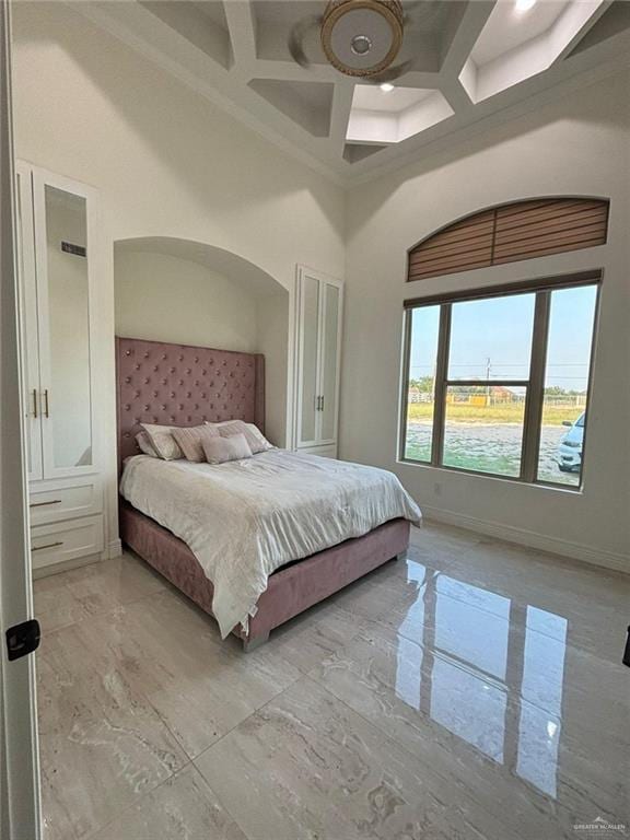 22303 Uresti Rd, Edinburg, TX 78542 - bedroom featuring coffered ceiling, a high ceiling, light marble finish flooring, beamed ceiling, and ceiling fan