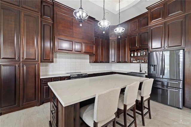 22303 Uresti Rd, Edinburg, TX 78542 - kitchen with appliances with stainless steel finishes, tasteful backsplash, open shelves, and light stone counters