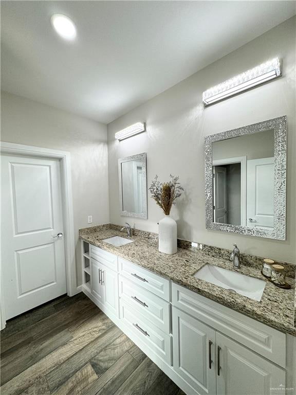 bathroom featuring hardwood / wood-style flooring and vanity