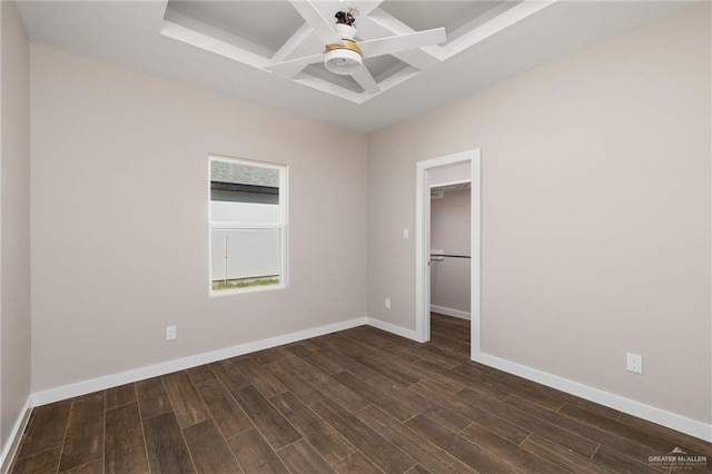 unfurnished room with dark hardwood / wood-style flooring and ceiling fan