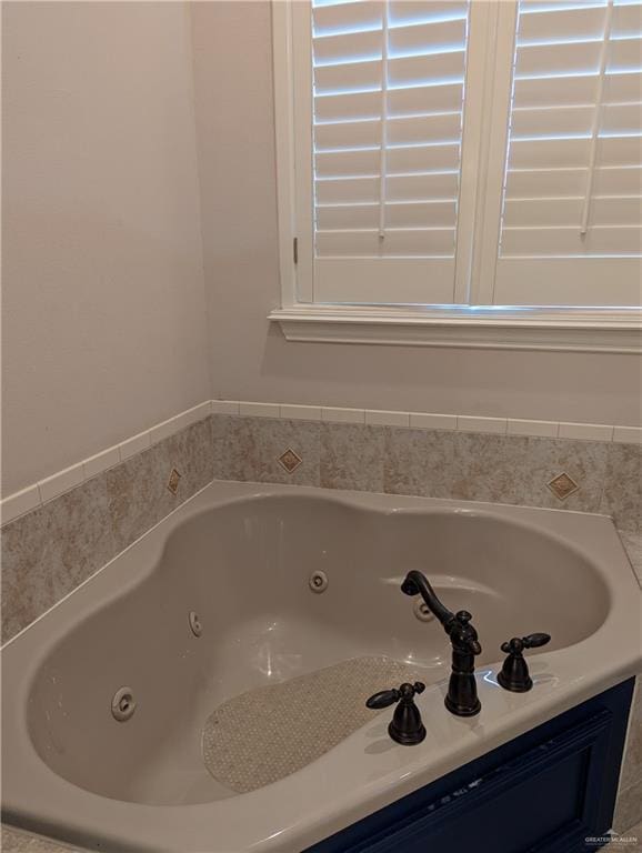 bathroom featuring a tub to relax in