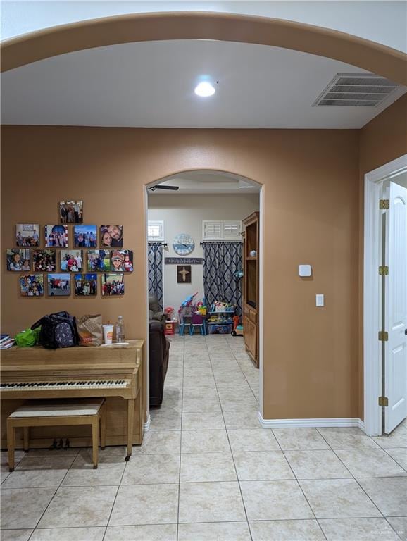 corridor featuring light tile patterned floors