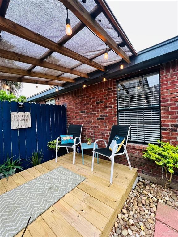 wooden terrace with a pergola