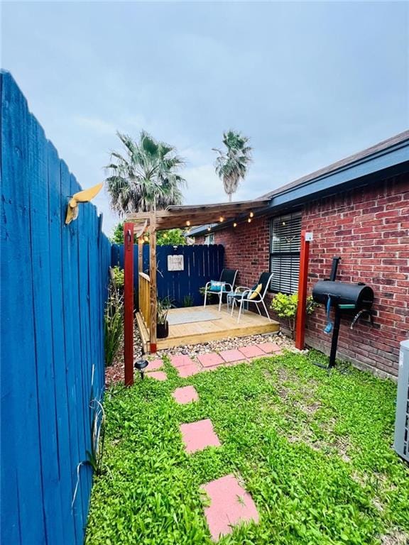 view of yard featuring a wooden deck