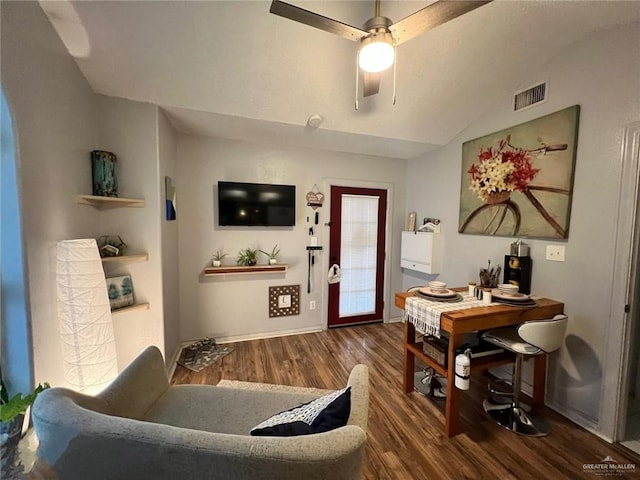 interior space with vaulted ceiling, dark hardwood / wood-style floors, and ceiling fan