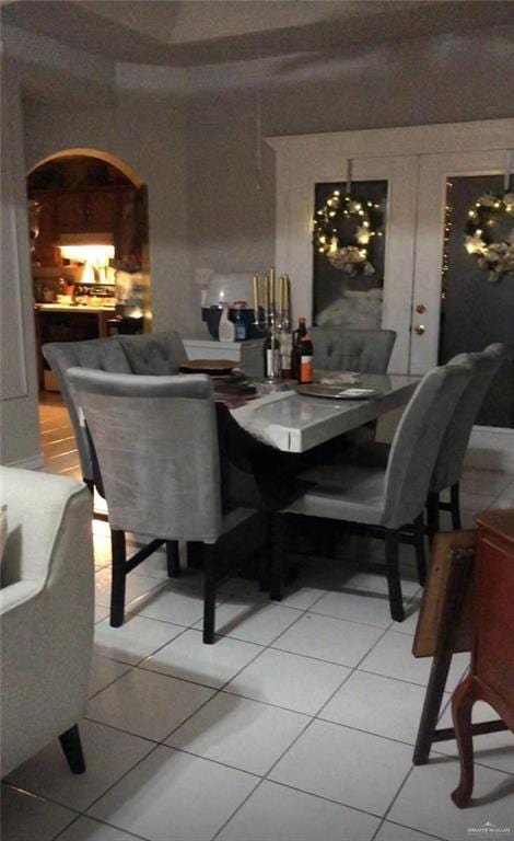 tiled dining room with french doors