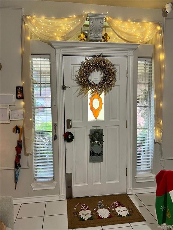 doorway with light tile patterned floors