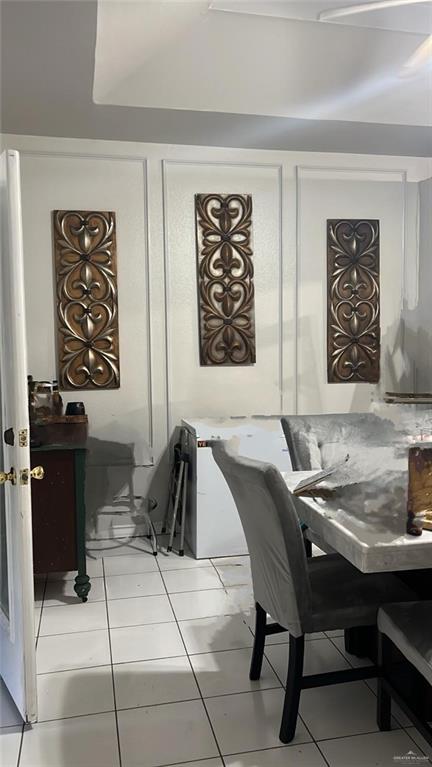 dining area featuring light tile patterned floors