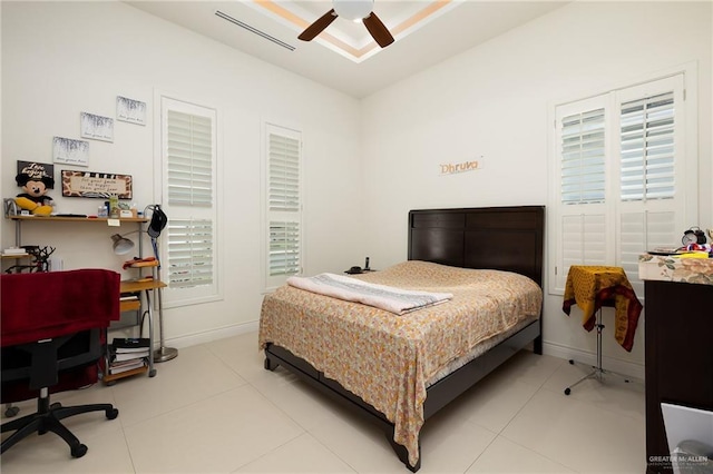 2408 Holland Ave, Edinburg, TX 78539 - tiled bedroom with baseboards, an office area, and a ceiling fan