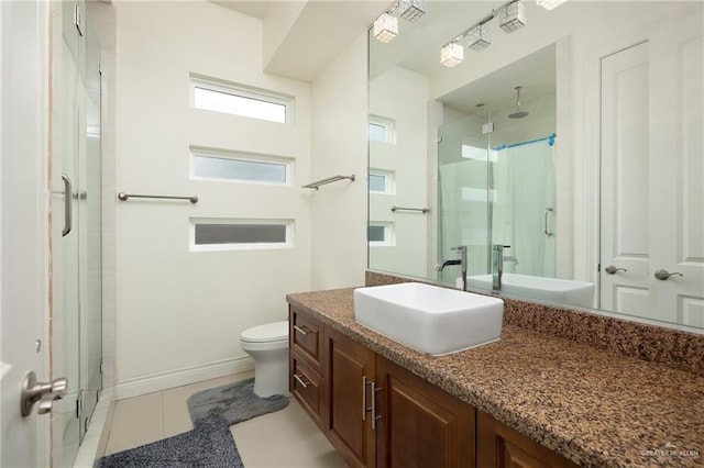 2408 Holland Ave, Edinburg, TX 78539 - full bathroom featuring vanity, a shower stall, toilet, and tile patterned flooring
