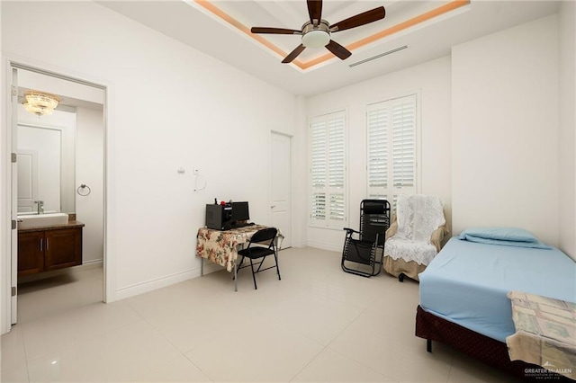 2408 Holland Ave, Edinburg, TX 78539 - bedroom with a desk, light tile patterned floors, and a ceiling fan