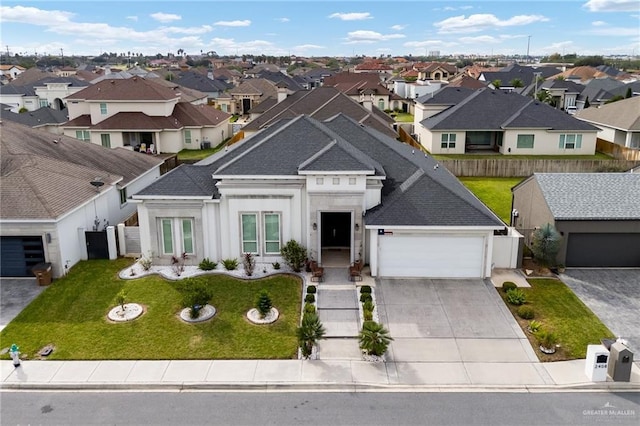 2408 Holland Ave, Edinburg, TX 78539 - view of front of home with a residential view, roof with shingles, driveway, and a garage