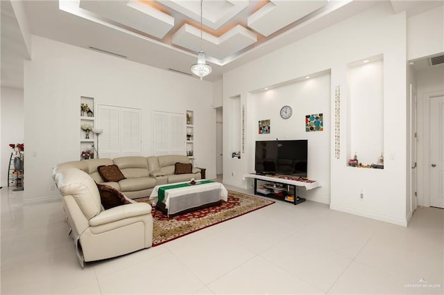 2408 Holland Ave, Edinburg, TX 78539 - living room featuring a high ceiling, baseboards, and tile patterned floors
