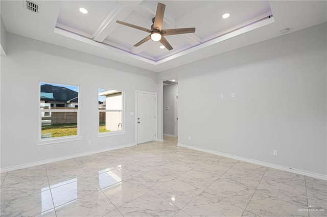 unfurnished room featuring beam ceiling, ceiling fan, coffered ceiling, and a high ceiling