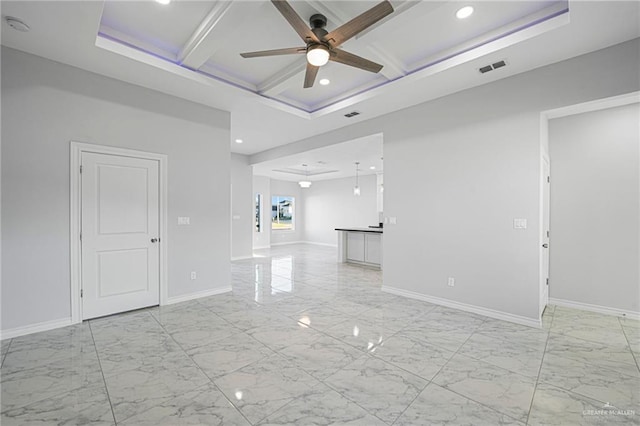 empty room featuring beamed ceiling, ceiling fan, and coffered ceiling