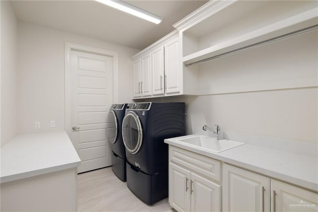 4552 Estancia Pkwy, Mcallen, TX 78504 - laundry room featuring washing machine and clothes dryer and cabinet space
