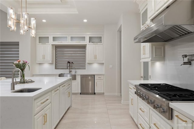 4552 Estancia Pkwy, Mcallen, TX 78504 - kitchen with stainless steel appliances, under cabinet range hood, light countertops, white cabinets, and recessed lighting