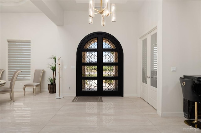 4552 Estancia Pkwy, Mcallen, TX 78504 - foyer entrance featuring a chandelier, french doors, and light tile patterned floors