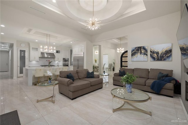 4552 Estancia Pkwy, Mcallen, TX 78504 - living room with a tray ceiling, a chandelier, ornamental molding, and recessed lighting