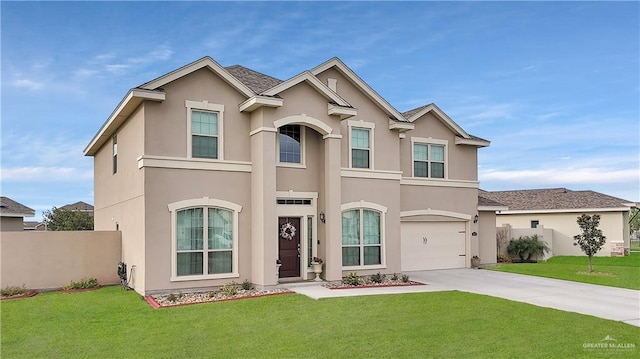 4816 Ensenada Ave, Mcallen, TX 78504 - view of front facade with stucco siding, concrete driveway, and an attached garage
