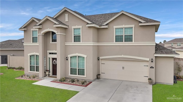 4816 Ensenada Ave, Mcallen, TX 78504 - view of front facade featuring roof with shingles, a garage, stucco siding, concrete driveway, and a front lawn
