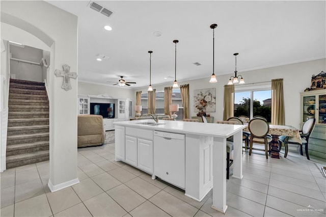 4816 Ensenada Ave, Mcallen, TX 78504 - kitchen featuring dishwasher, light tile patterned flooring, open floor plan, white cabinets, and ornamental molding