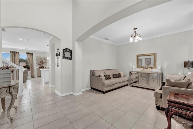 4816 Ensenada Ave, Mcallen, TX 78504 - living area with arched walkways, light tile patterned floors, a chandelier, and ornamental molding