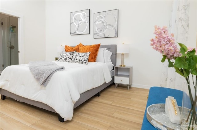 bedroom with wood-type flooring