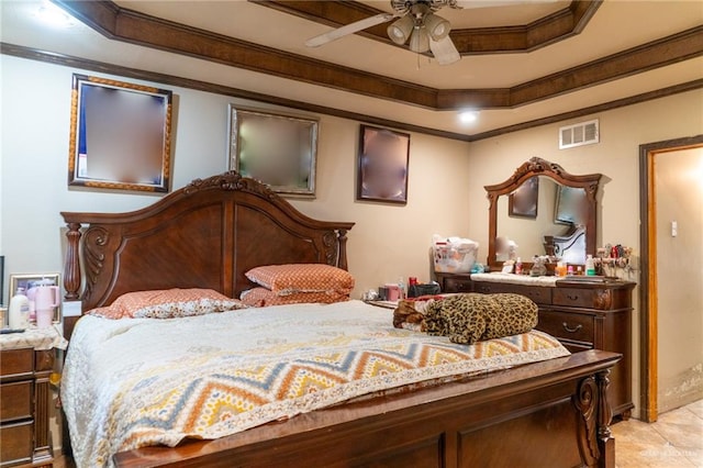 bedroom featuring ceiling fan, light tile patterned floors, crown molding, and a tray ceiling