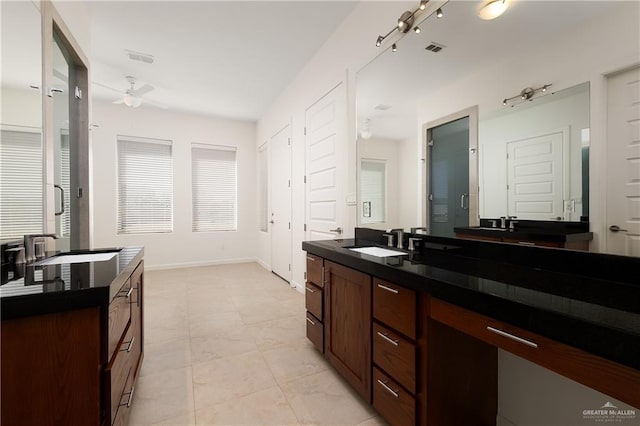 bathroom featuring tile patterned flooring, sink, and ceiling fan