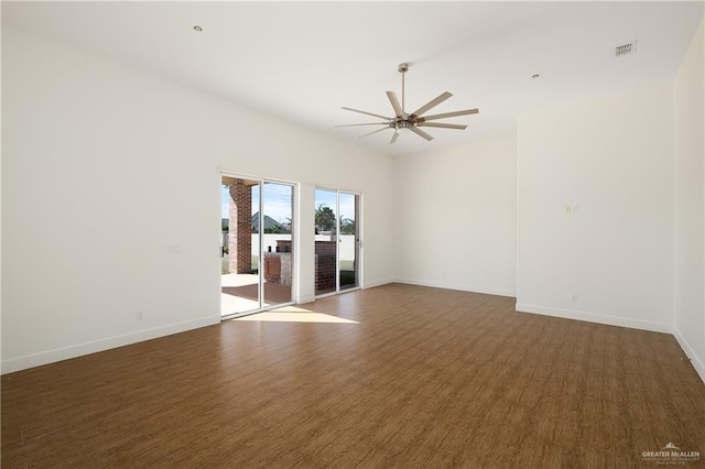 unfurnished room featuring dark wood-type flooring and ceiling fan