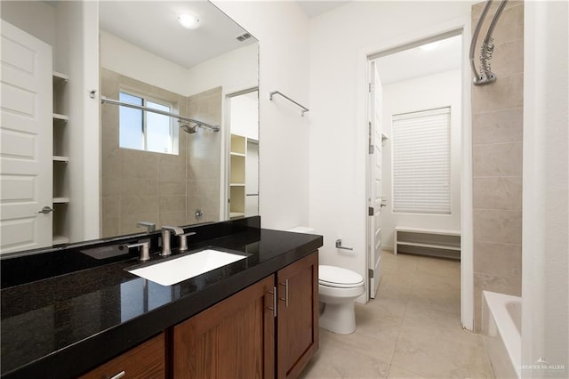 bathroom featuring tile patterned floors, vanity, and toilet