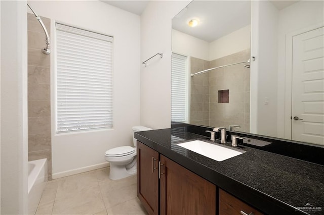 full bathroom with tiled shower / bath combo, vanity, tile patterned floors, and toilet