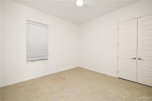 unfurnished room featuring ceiling fan