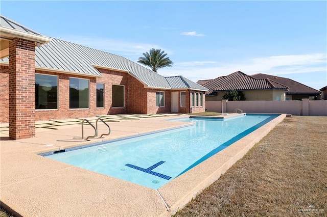 view of swimming pool featuring a patio