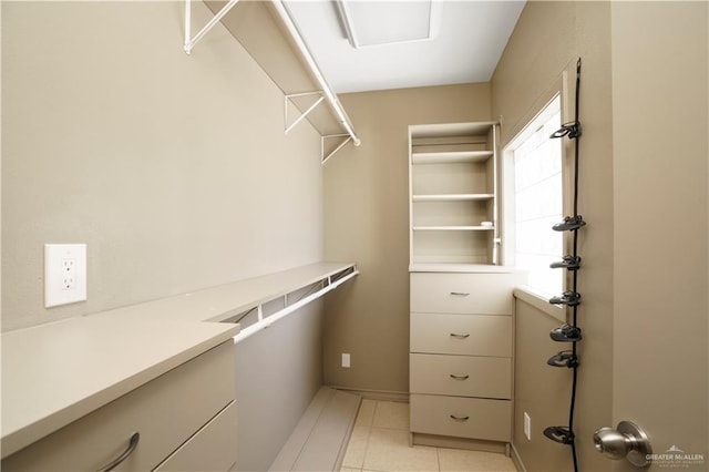 walk in closet featuring light tile patterned floors