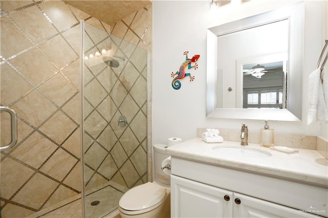 bathroom featuring ceiling fan, toilet, an enclosed shower, and vanity