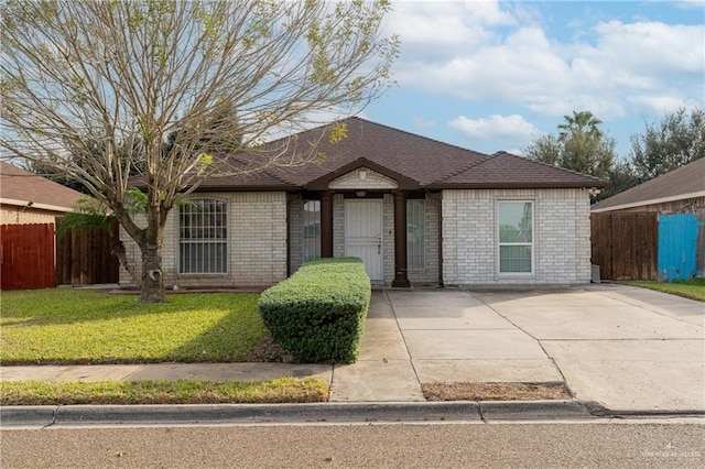 ranch-style house with a front lawn