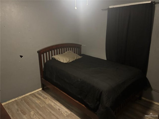 609 S 24th St, Donna, TX 78537 - bedroom with wood finished floors and baseboards
