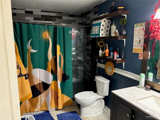 609 S 24th St, Donna, TX 78537 - bathroom featuring a shower with shower curtain, vanity, toilet, and tile patterned floors