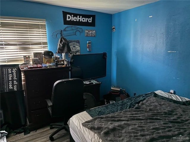 609 S 24th St, Donna, TX 78537 - bedroom featuring wood finished floors and an office area