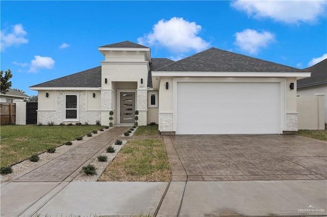 3007 S Livingston St, Edinburg, TX 78542 - prairie-style house with driveway, a garage, a shingled roof, stucco siding, and stone siding