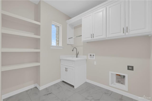 3007 S Livingston St, Edinburg, TX 78542 - laundry area featuring electric dryer hookup, light marble finish flooring, washer hookup, cabinet space, and baseboards