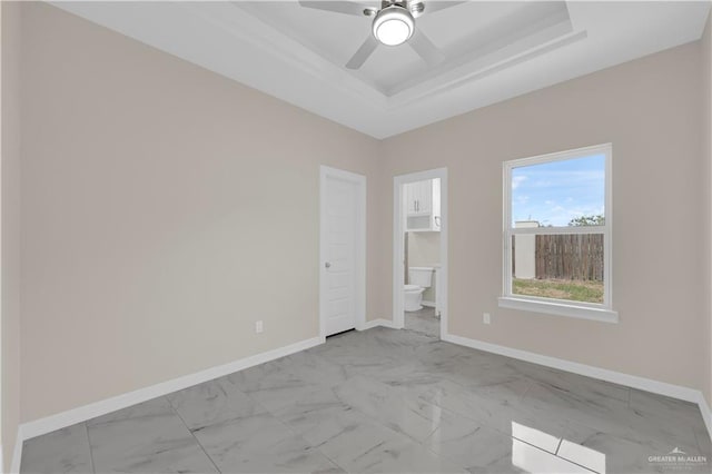3007 S Livingston St, Edinburg, TX 78542 - unfurnished room with light marble finish flooring, a tray ceiling, baseboards, and ceiling fan
