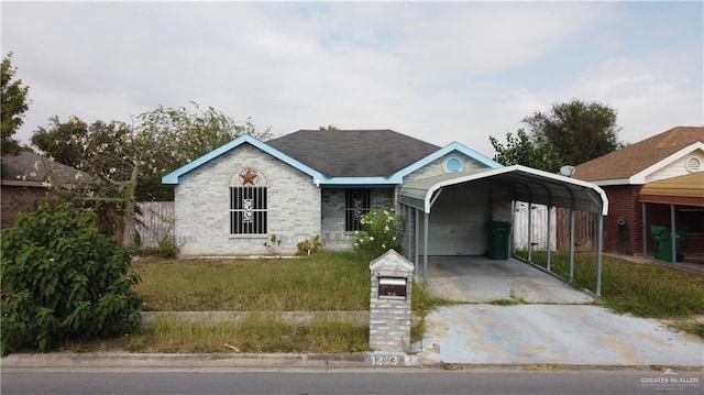 ranch-style house featuring a carport