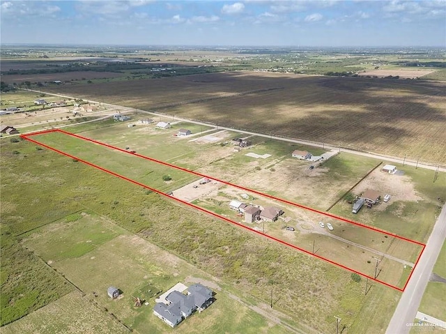 birds eye view of property featuring a rural view