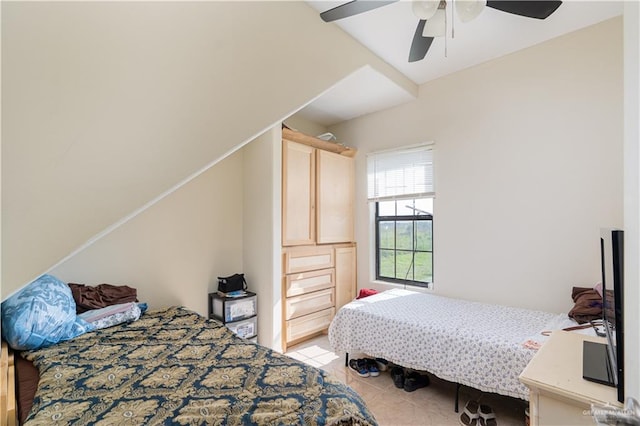 tiled bedroom with ceiling fan